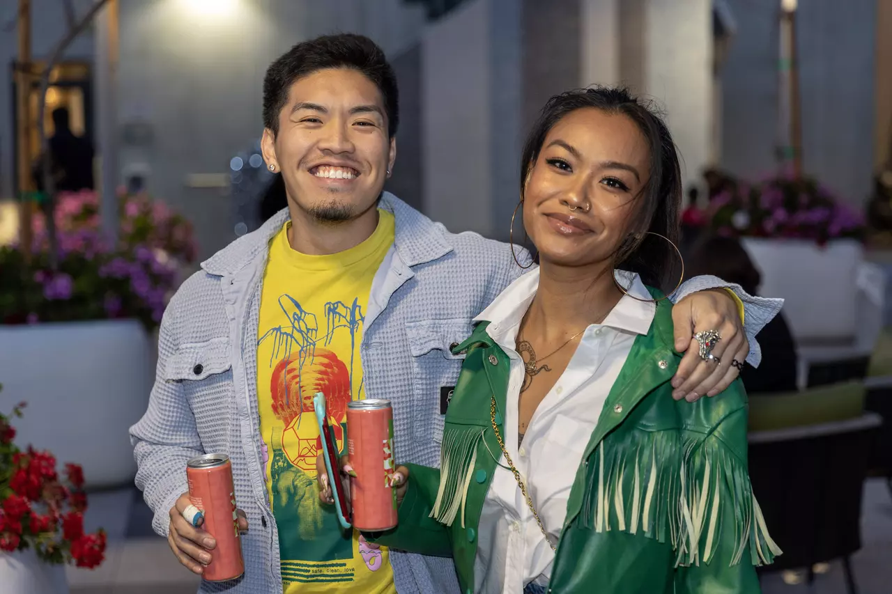 Two People Posing for a Picture in a TENTEN Rooftop Event